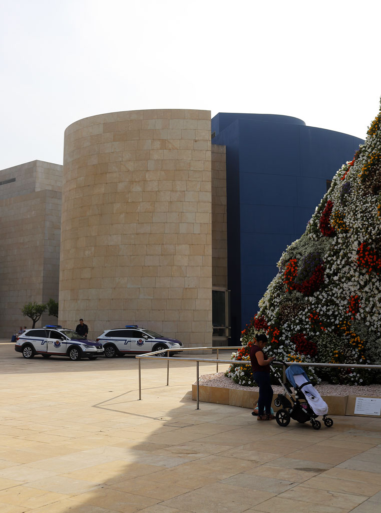 Puppy by Jeff Koons (stage right with mother and police)